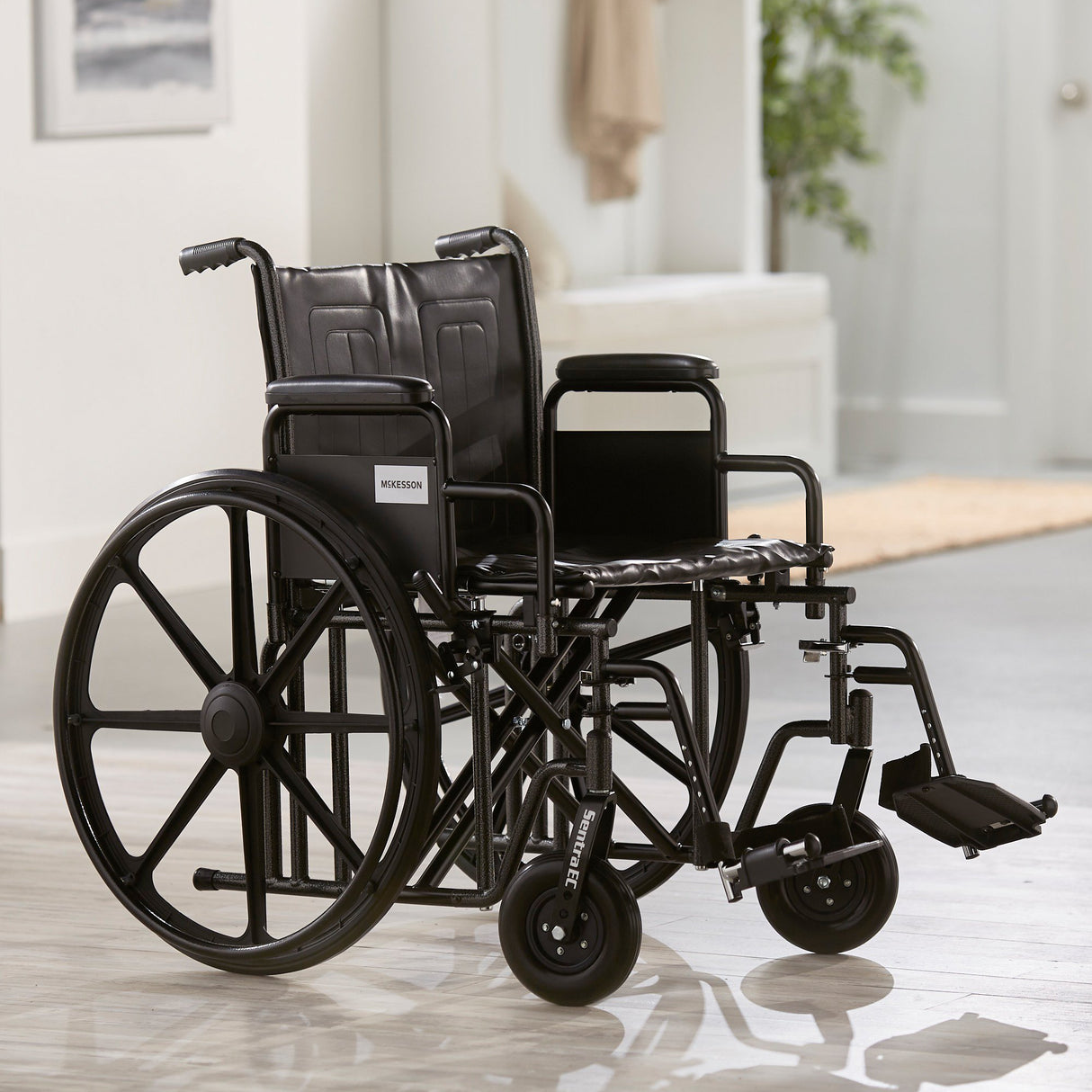 Bariatric Wheelchair McKesson Dual Axle Desk Length Arm Swing-Away Footrest Black Upholstery 22 Inch Seat Width Adult 450 lbs. Weight Capacity