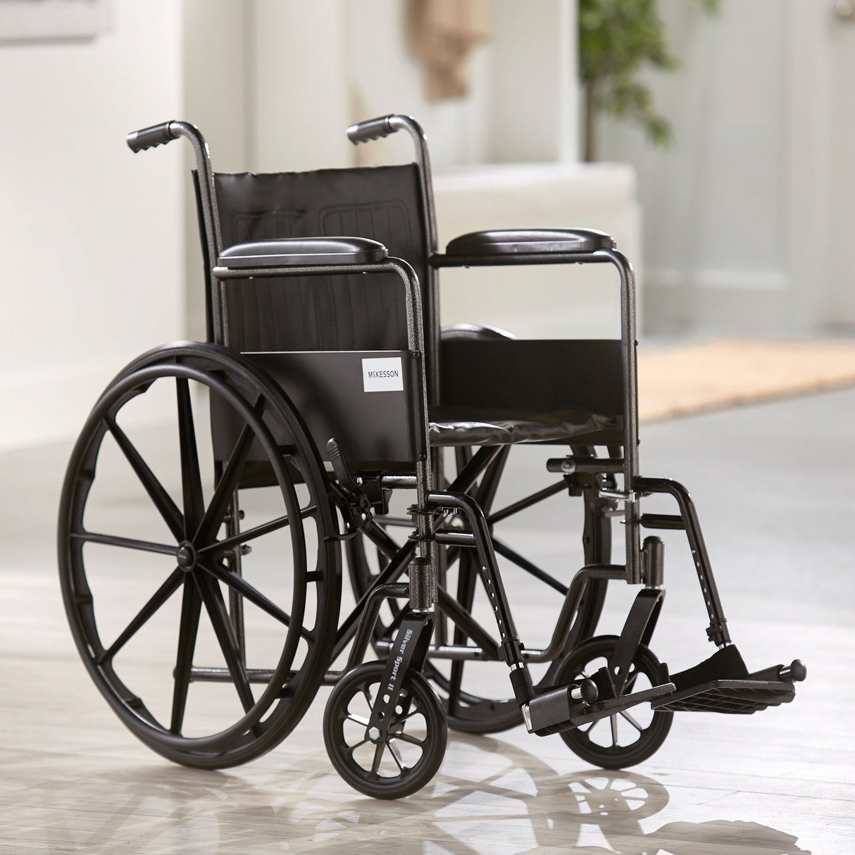 Wheelchair McKesson Dual Axle Full Length Arm Swing-Away Footrest Black Upholstery 18 Inch Seat Width Adult 300 lbs. Weight Capacity